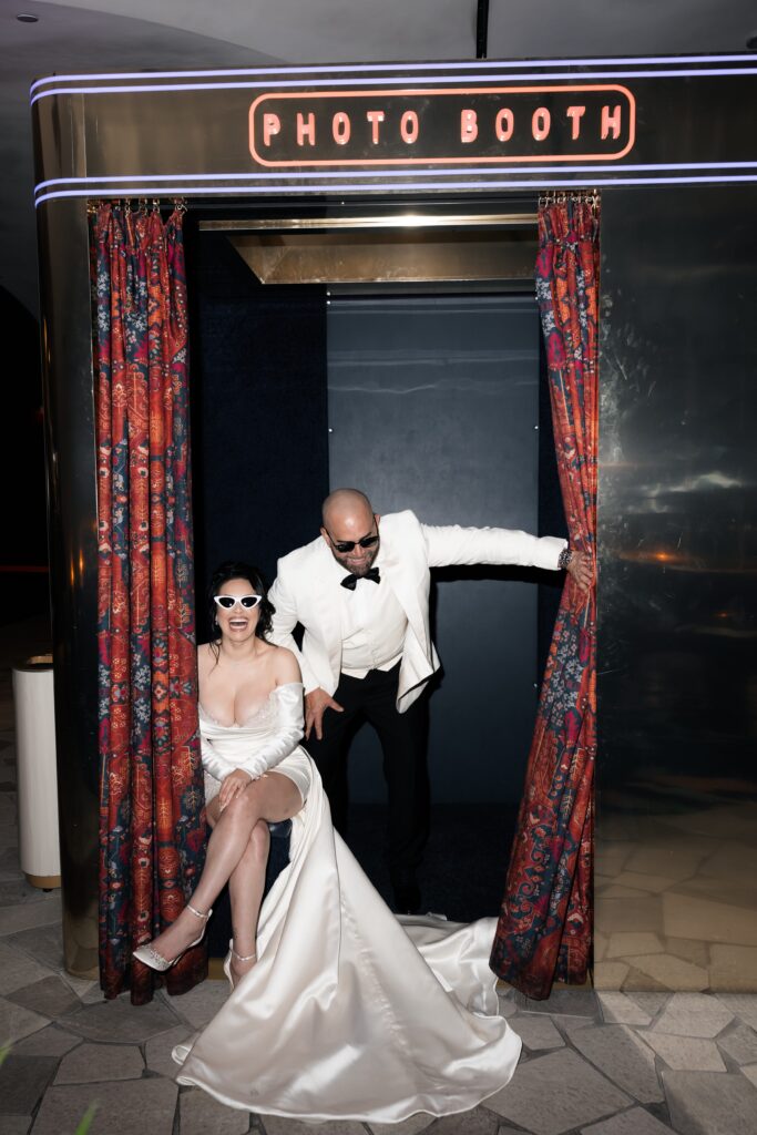 Bride and groom laughing during their Las Vegas elopement portraits at Virgin Hotel in Las Vegas