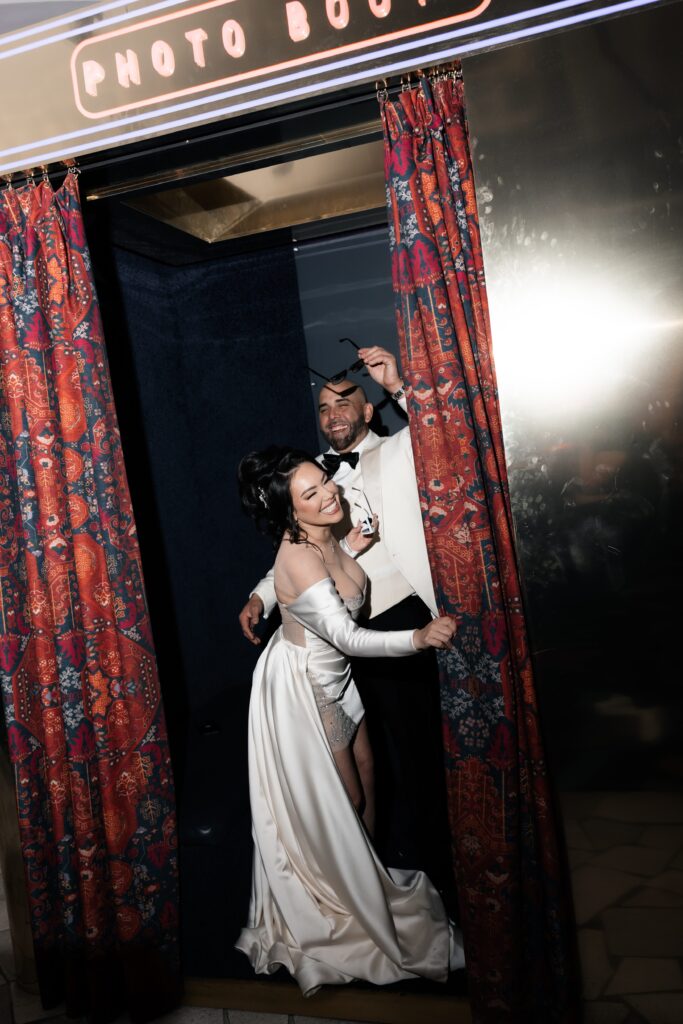 Bride and groom laughing during their Las Vegas elopement portraits at Virgin Hotel in Las Vegas