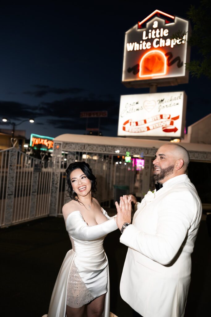 Bride and groom holding hands during their elopement photos