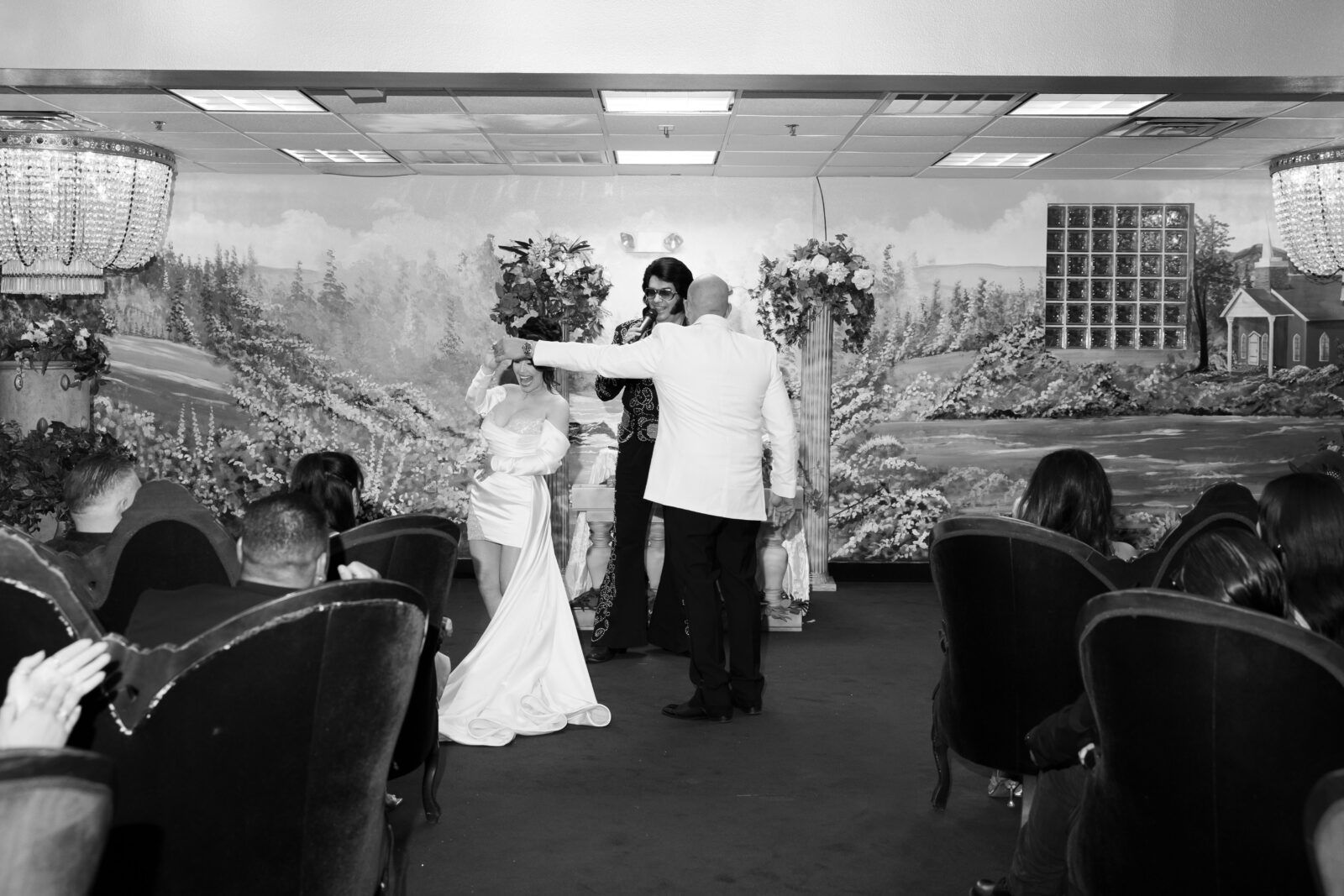 Bride and groom dancing as Elvis serenades to them