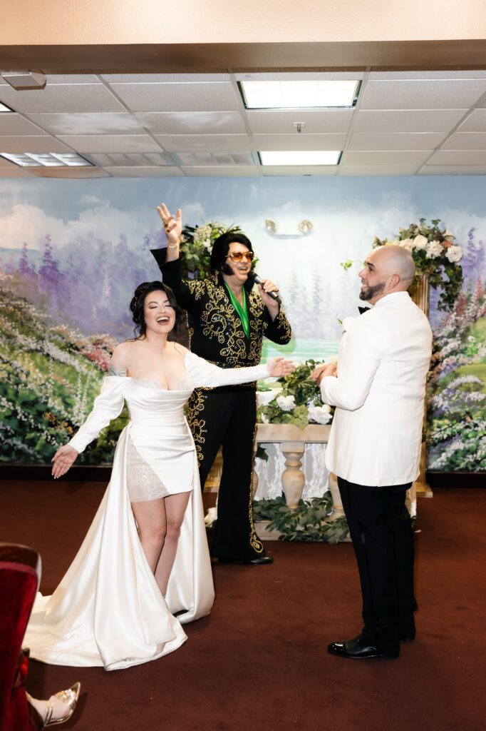 Bride and groom dancing in Chapel Amore as the Elvis impersonator sings to them during their Elvis wedding ceremony at The Little White Wedding Chapel