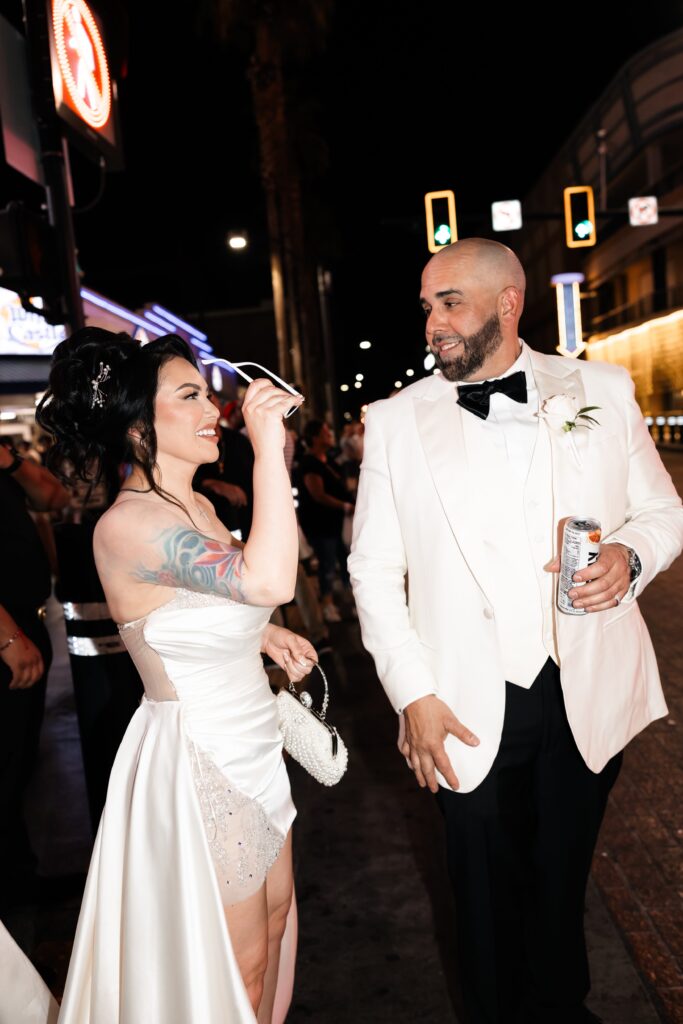 Flash elopement photos of a bride and groom during their downtown Vegas elopement on Fremont Street