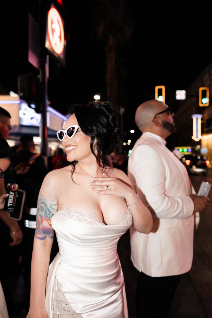 Flash elopement photos of a bride and groom during their downtown Vegas elopement on Fremont Street