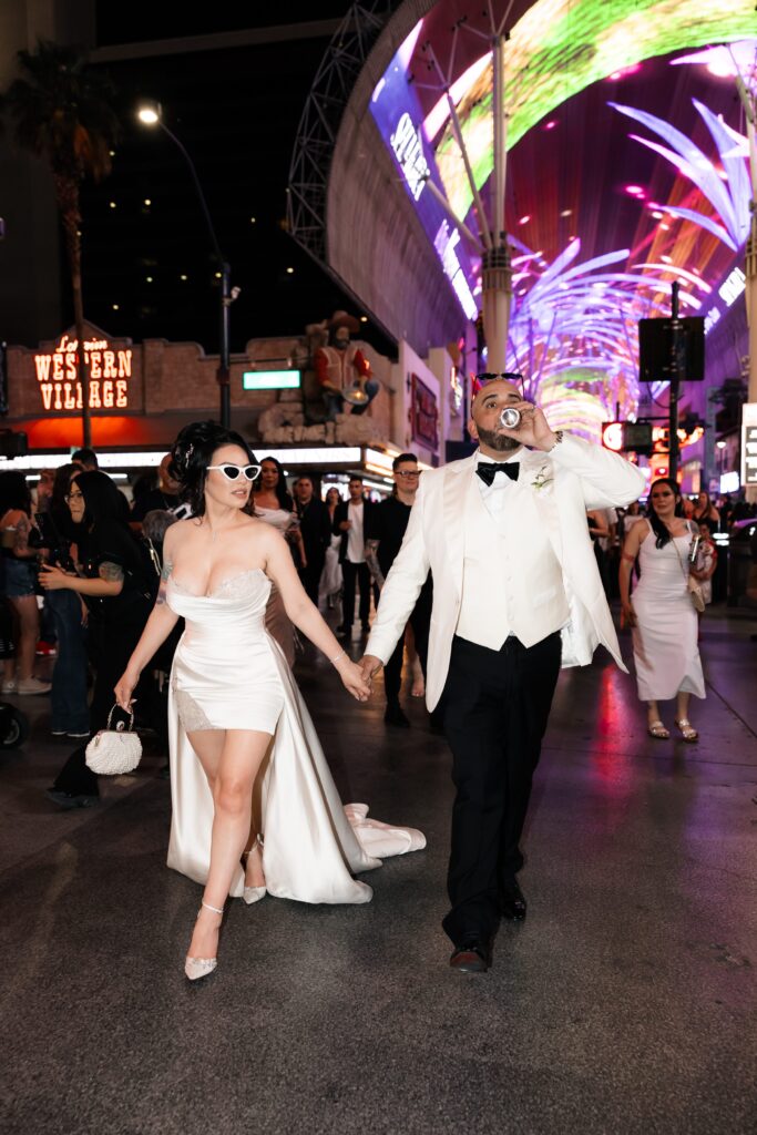 Flash elopement photos of a bride and groom during their downtown Vegas elopement on Fremont Street