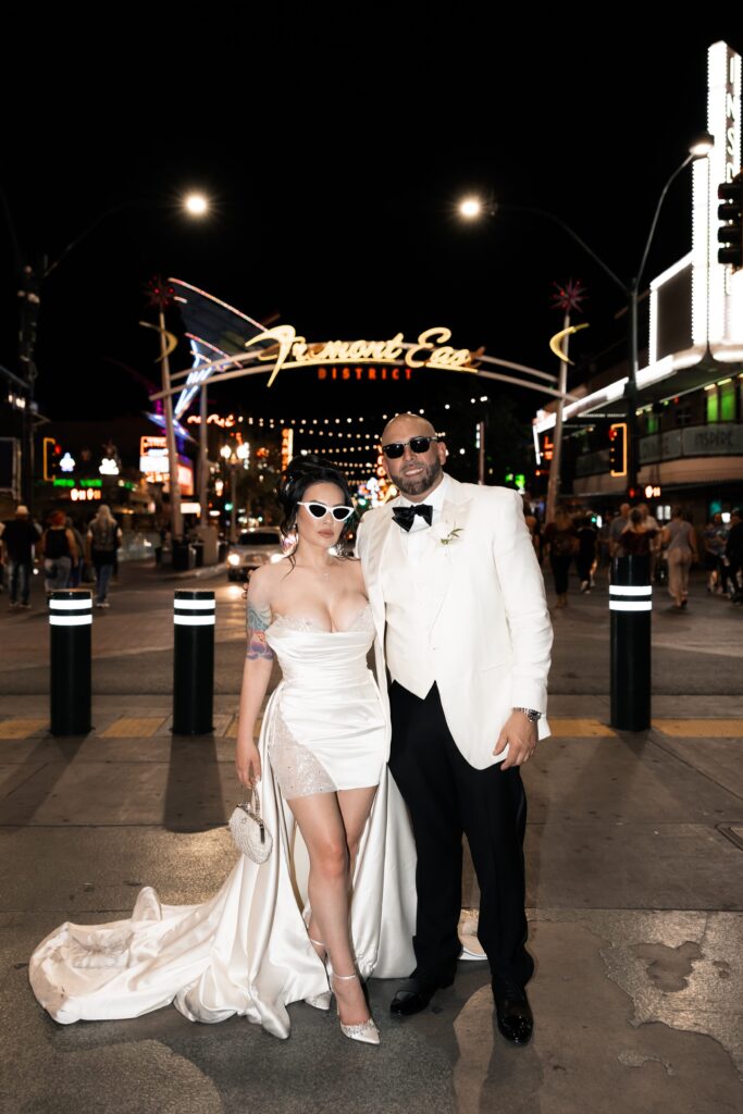 Flash elopement photos of a bride and groom during their downtown Vegas elopement on Fremont Street