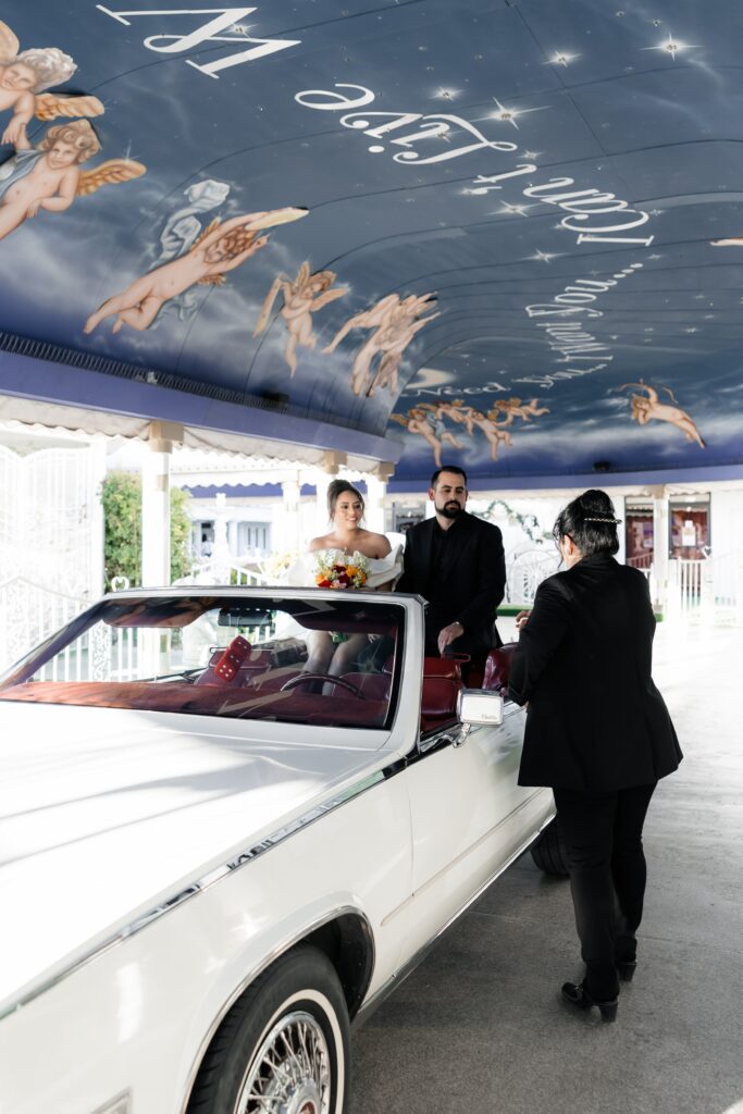 Bride and grooms intimate Little White Chapel elopement ceremony with a 1985 Cadillac El Dorado