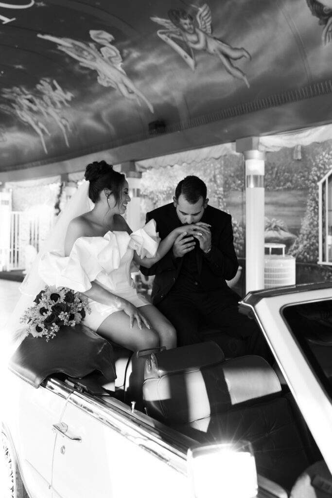 Bride and grooms intimate Little White Chapel elopement ceremony with a 1985 Cadillac El Dorado