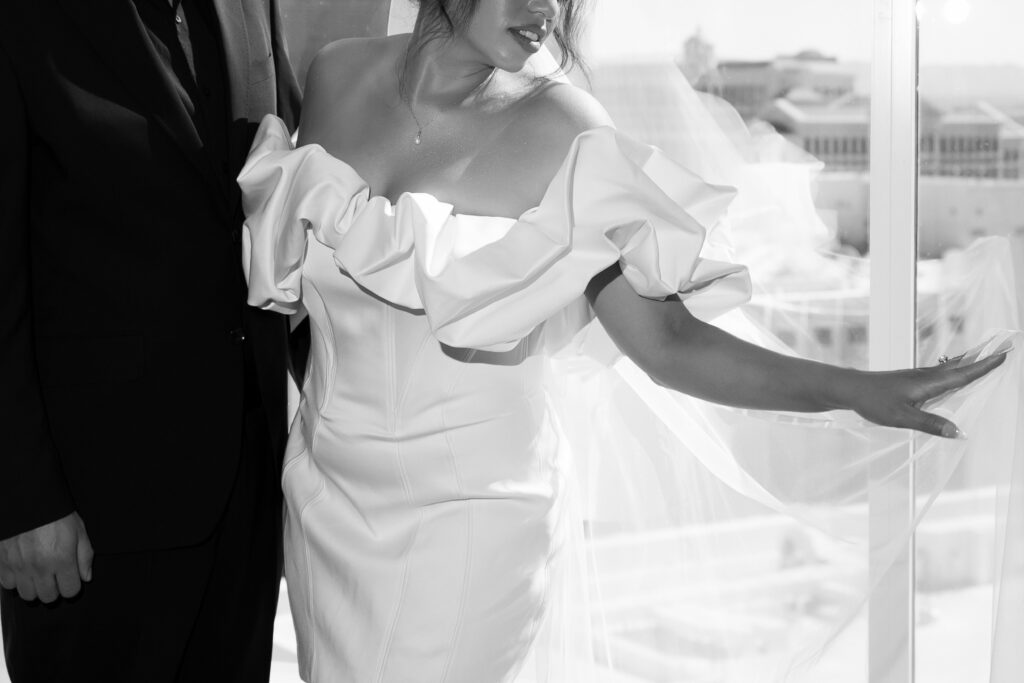 Black and white photo of a bride and groom inside of their suite at The Venetian