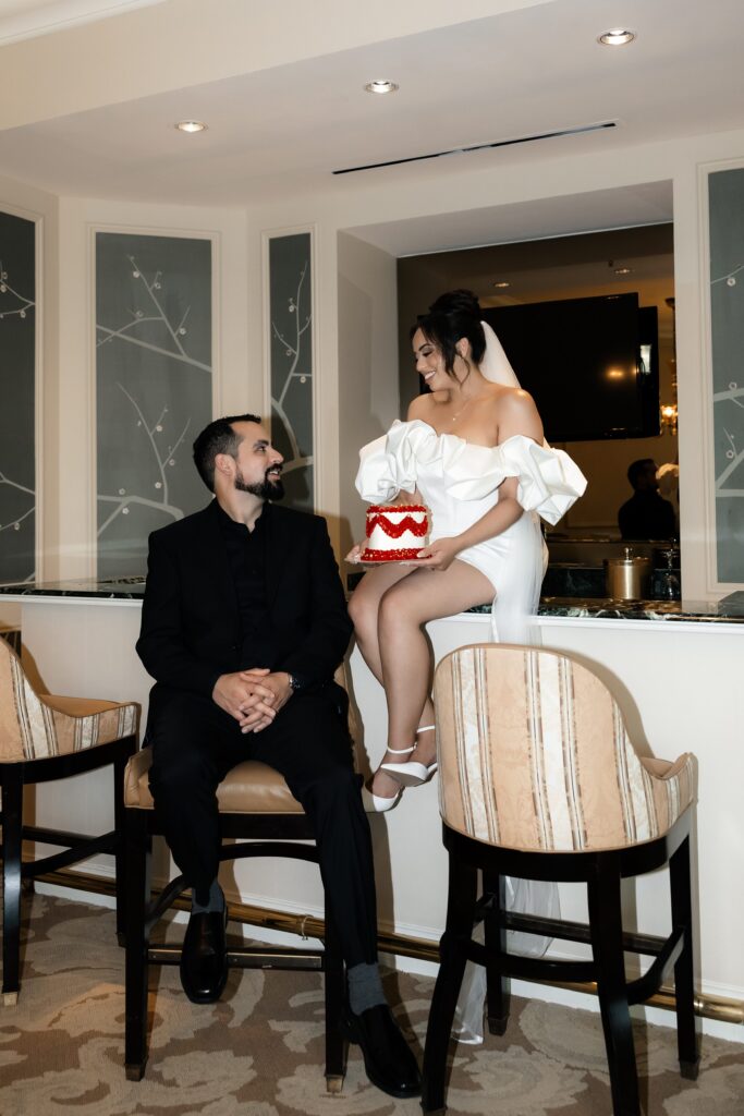 Bride and groom with their Las Vegas elopement cake made by Winston Marie Cakes