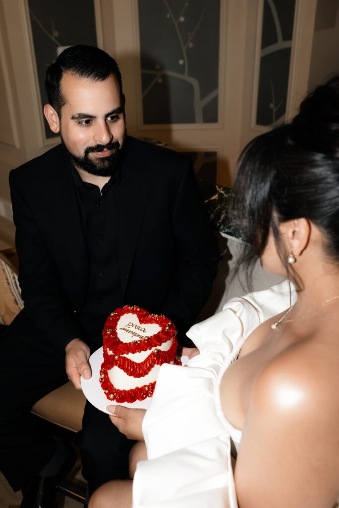 Bride and groom with their Las Vegas elopement cake make by Winston Marie Cakes