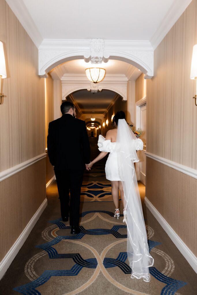 Bride and groom walking down the hallways at The Venetian