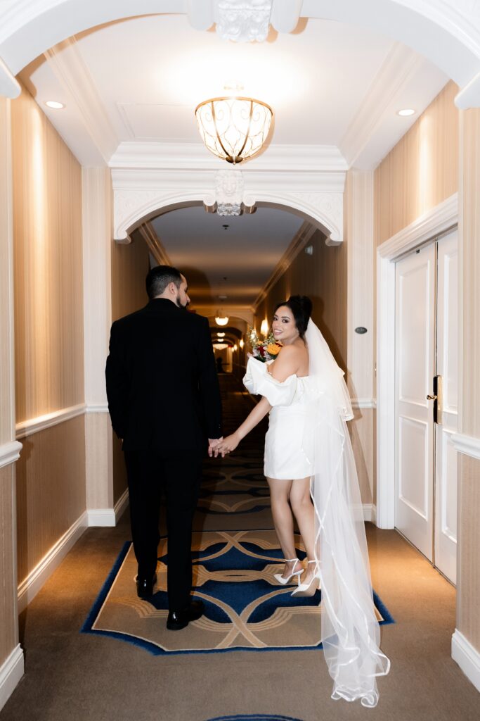 Bride and groom walking down the hallways at The Venetian