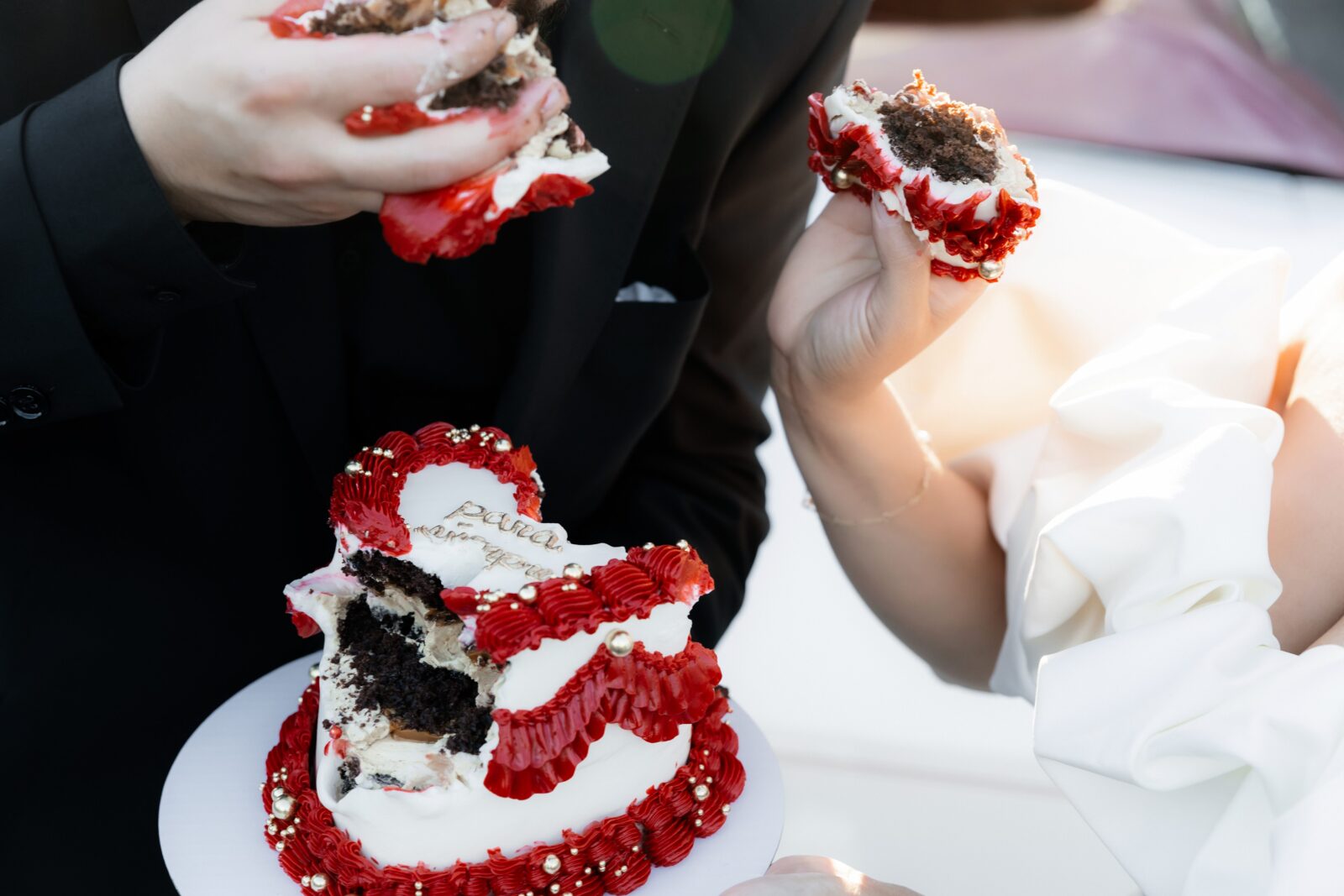 Bride and groom digging into their Las Vegas elopement cake made by Winston Marie Cakes