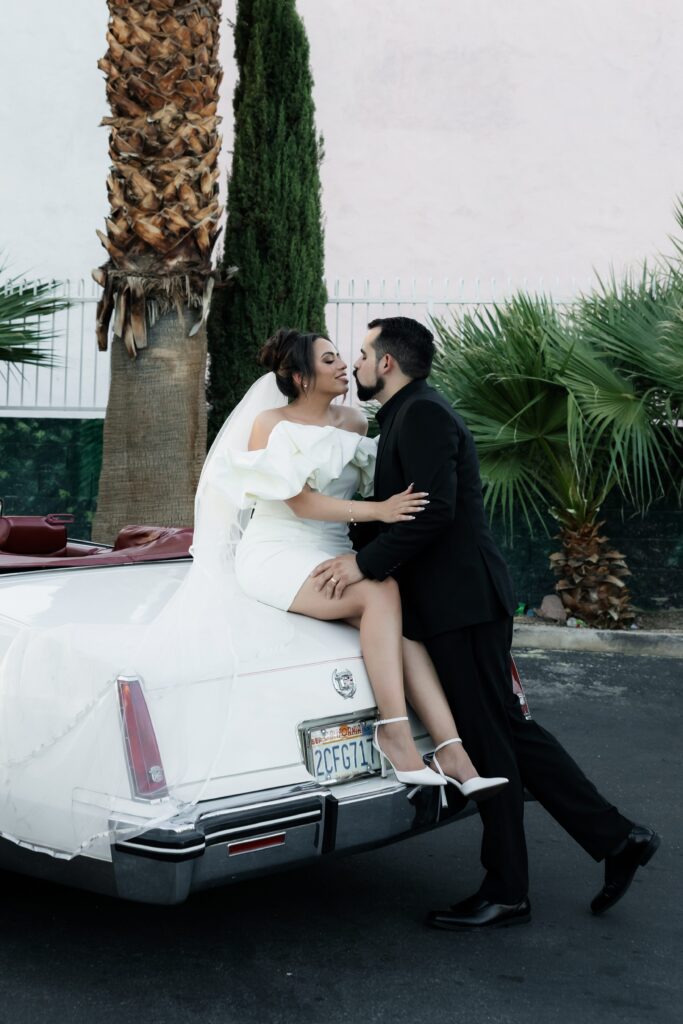 Bride and grooms Las Vegas elopement portraits with The Risky Ride - a 1985 Cadillac El Dorado