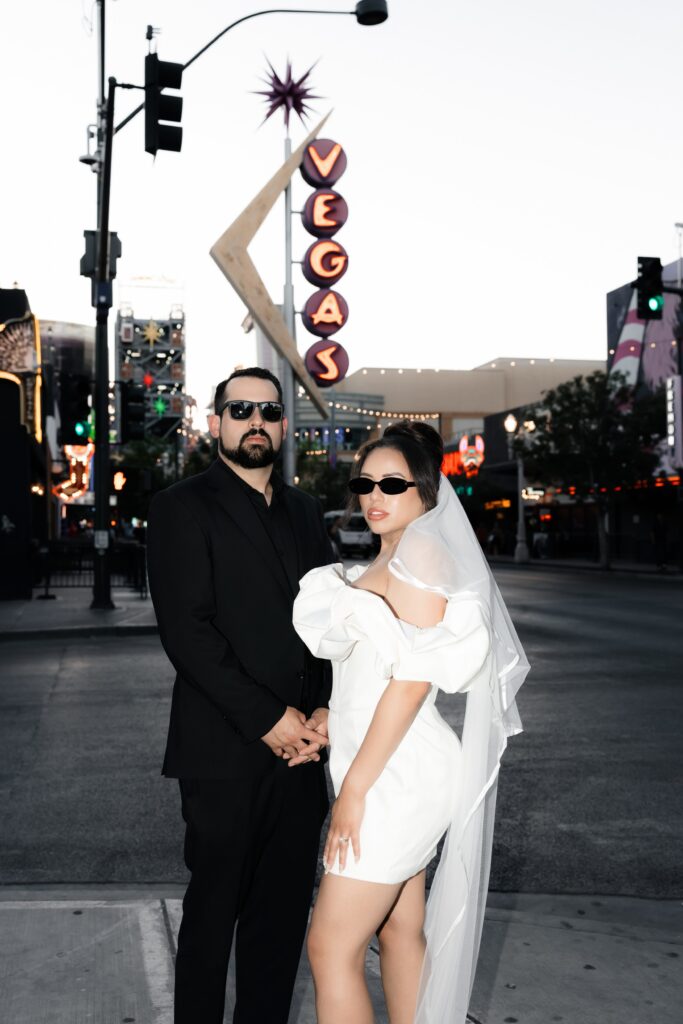 Bride and grooms Las Vegas elopement photos with the vintage neon sign