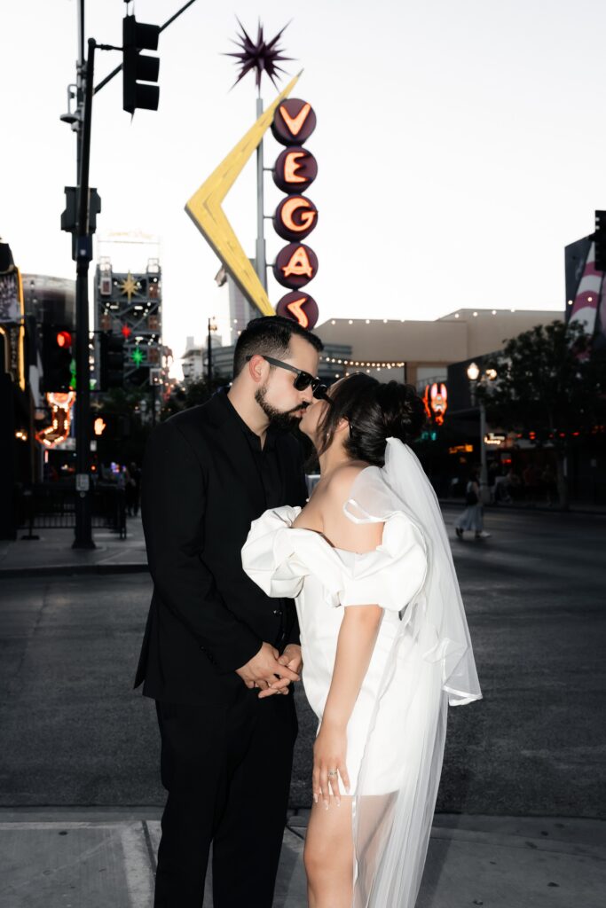 Bride and grooms Las Vegas elopement photos with the vintage neon sign