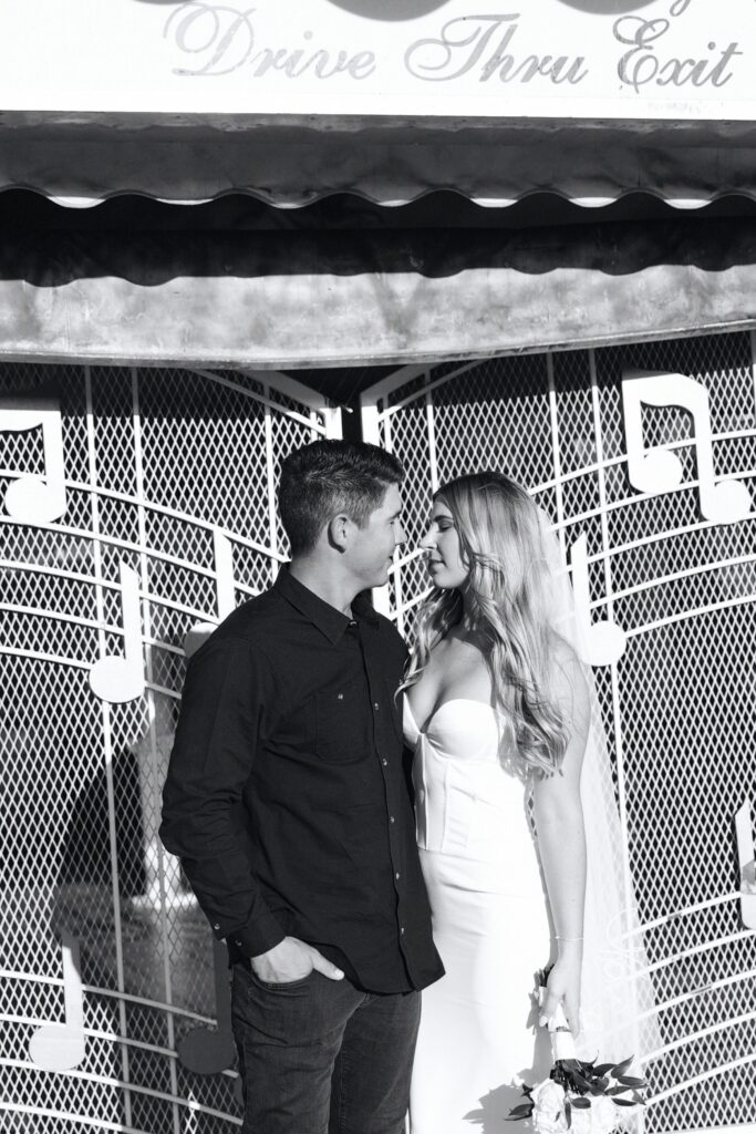 Black and white elopement photo of a bride and groom during their Las Vegas wedding