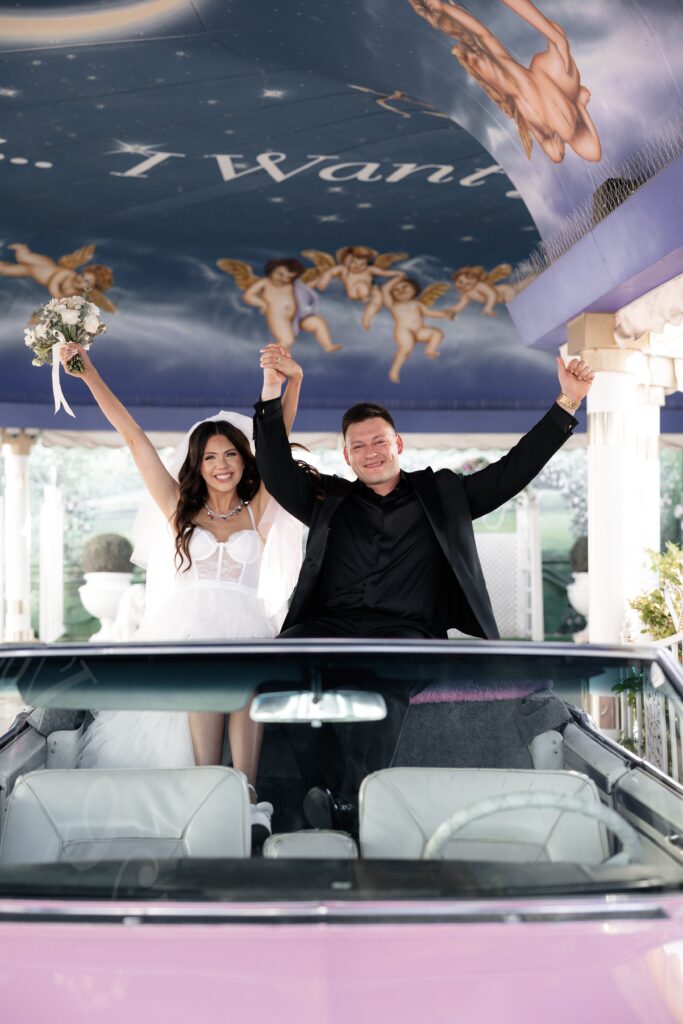 Bride and groom during their Pink Cadillac Ceremony