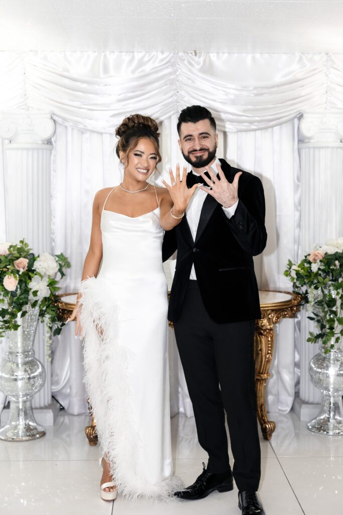 Bride and groom showing off their rings after their Little White Wedding Chapel Las Vegas elopement