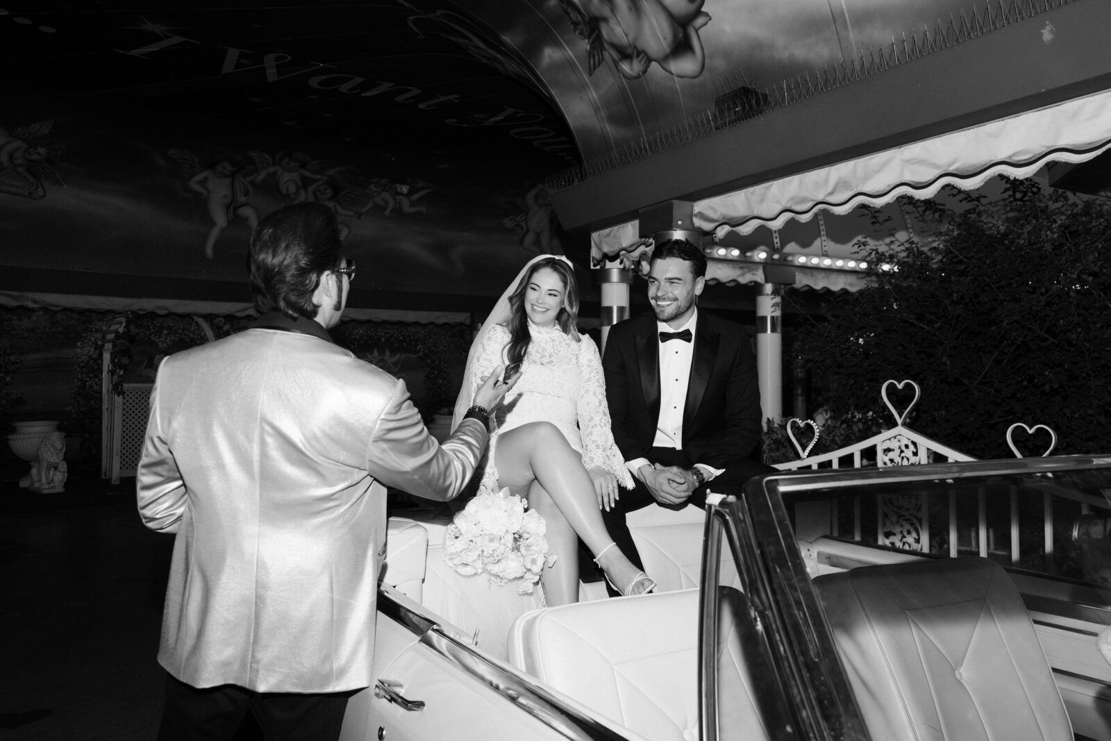 Black and white photo of a bride and groom during their Elvis wedding ceremony.