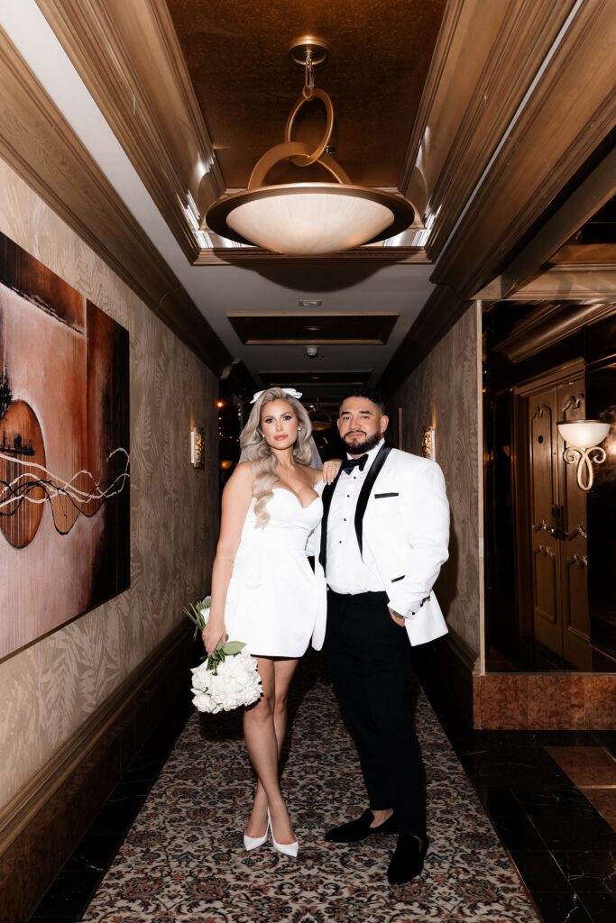 Bride and groom posing in the hallways at Golden Nugget in Las Vegas