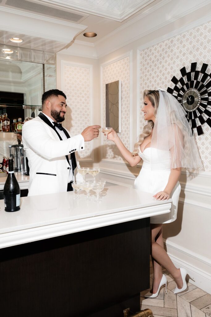 Bride and groom toasting champagne at Golden Nugget in Las Vegas