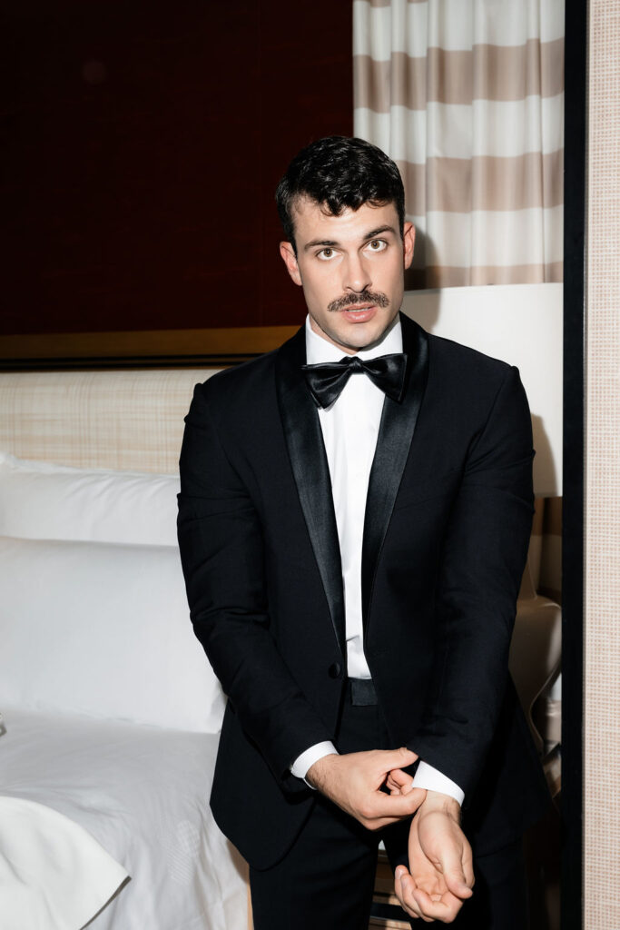 Editorial grooms portraits as he gets ready for his Las Vegas hotel elopement