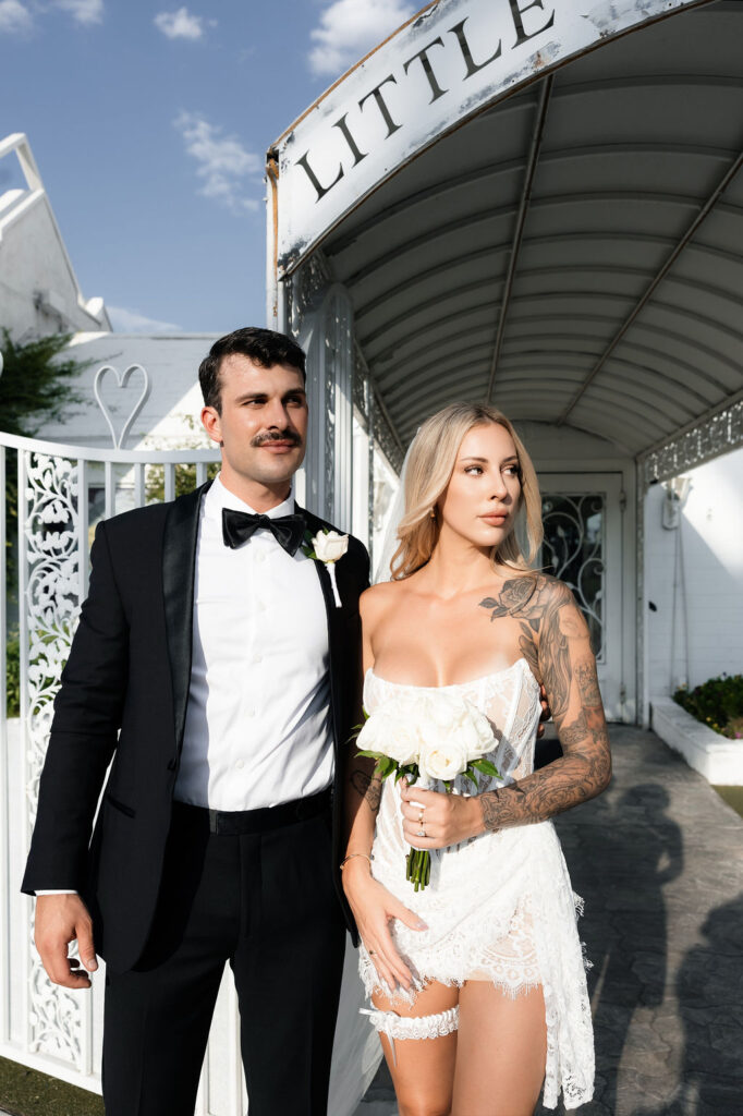 Bride and grooms editorial portraits in front of The Little White Chapel in Las Vegas