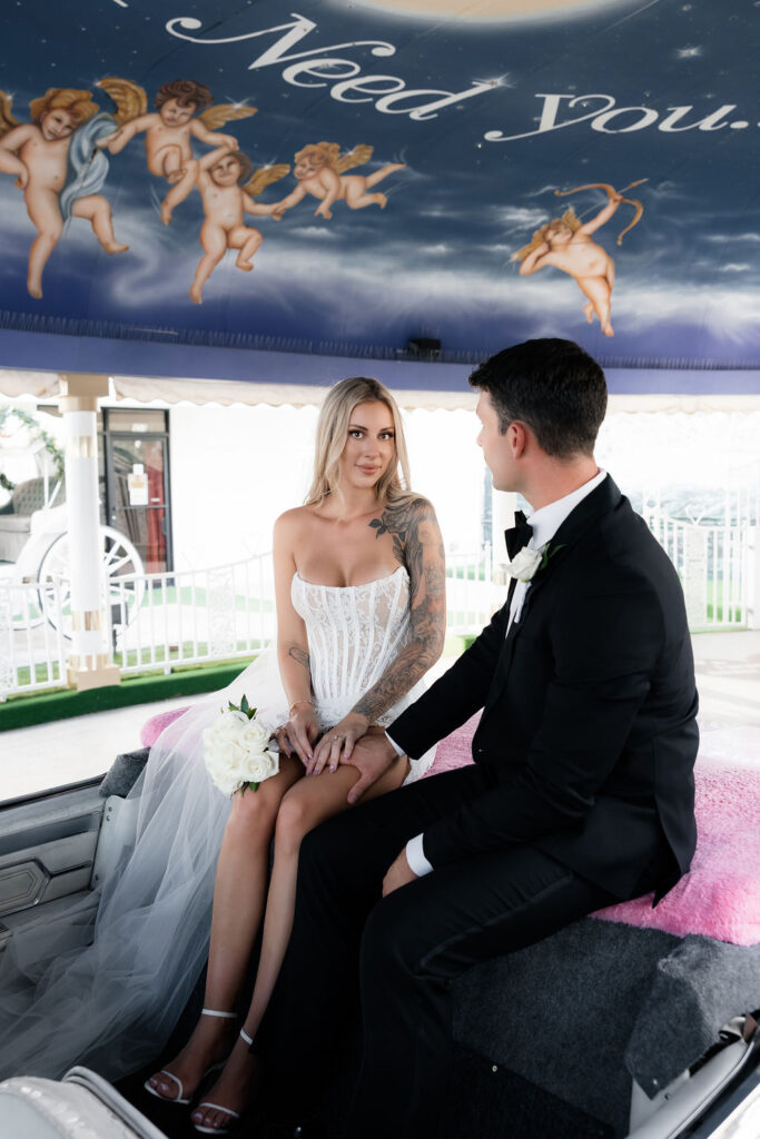 Bride and grooms Pink Cadillac Ceremony at The Little White Wedding Chapel