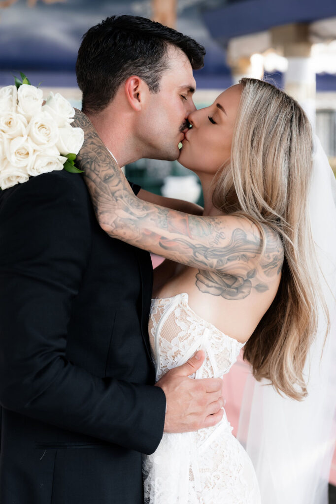 Bride and groom kissing in The Tunnel of Love