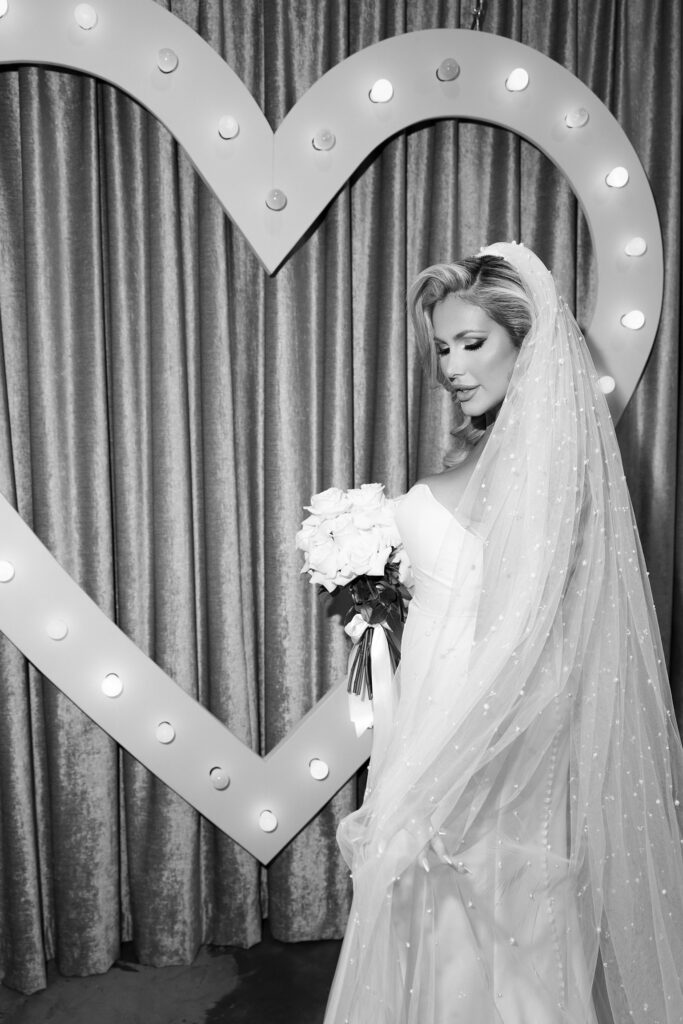 Black and white photo of a bride at Sure Thing Wedding Chapel in Las Vegas