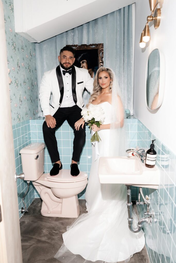 Bride and grooms portraits in Sure Thing Chapel's bathroom in Las Vegas