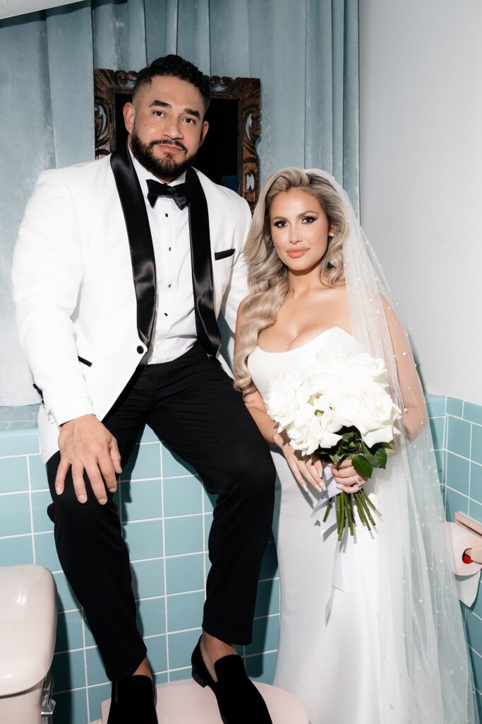 Bride and grooms portraits in Sure Thing Chapel's bathroom in Las Vegas