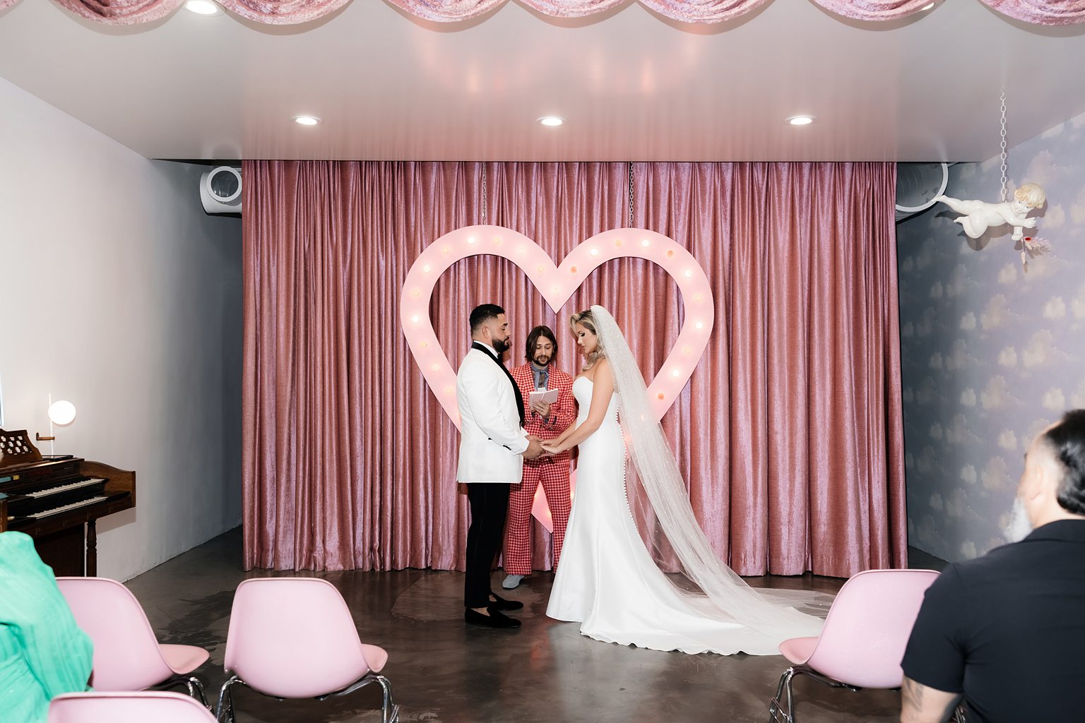 Bride and groom holding hands at the altar for their Sure Thing Wedding Chapel ceremony