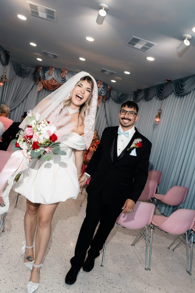 Bride and groom walking back down the aisle as husband and wife at Sure Thing Too
