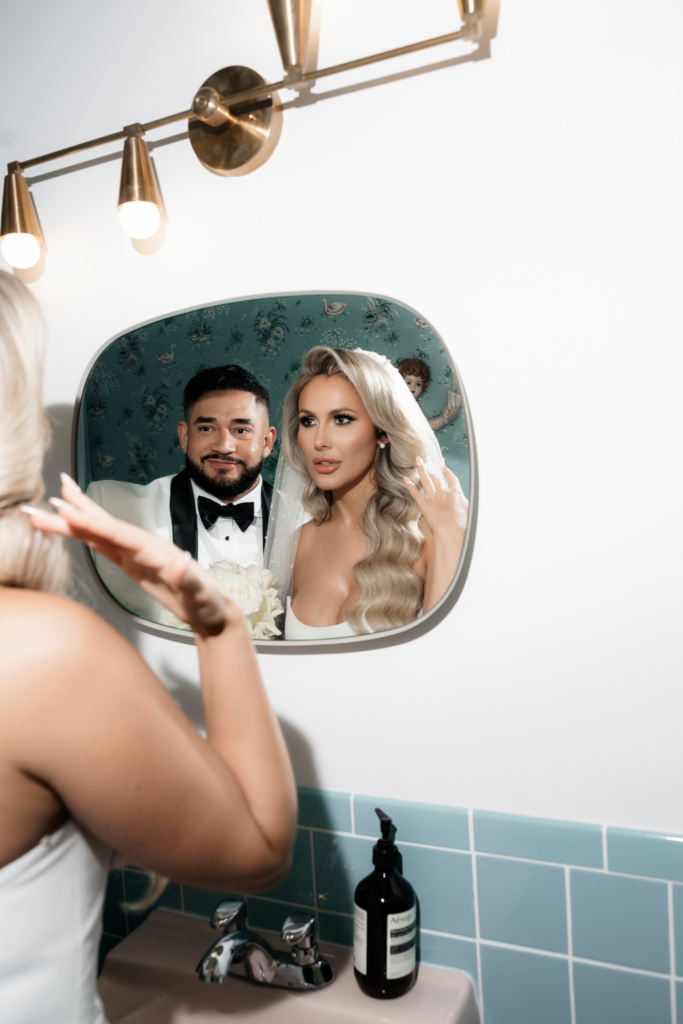 Bride and grooms portraits in the Sure Thing Chapel bathroom