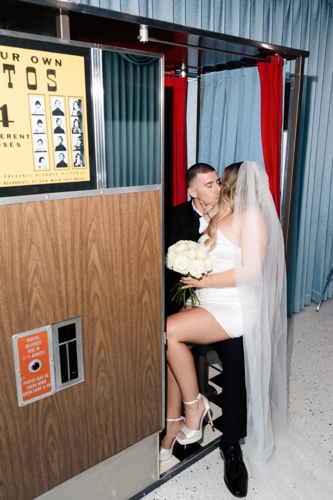 Couple sitting in the photobooth at Sure Thing Too in Las Vegas