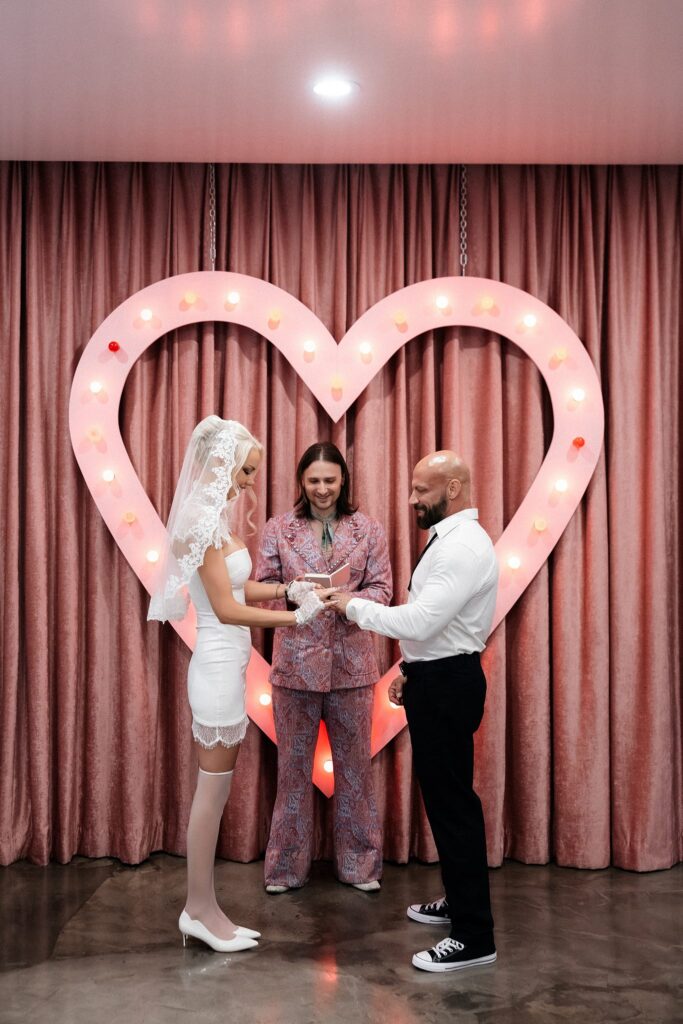 Bride and groom standing at the altar during their Sure Thing Chapel wedding.