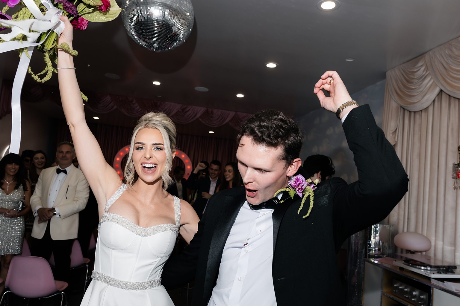 Bride and groom celebrating after their Sure Thing Chapel wedding ceremony