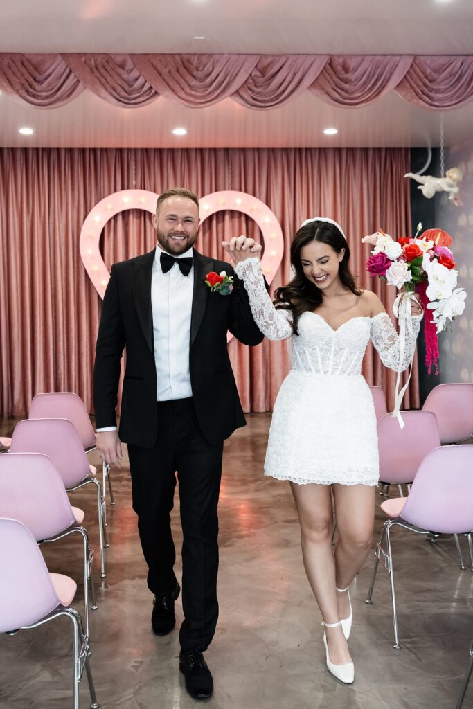 Bride and groom walking back down the aisle as husband and wife at Sure Thing Chapel in Las Vegas