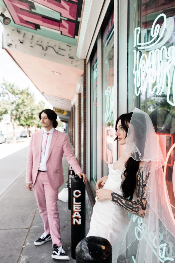 Couple posing outside of Sure Thing Chapel in Las Vegas