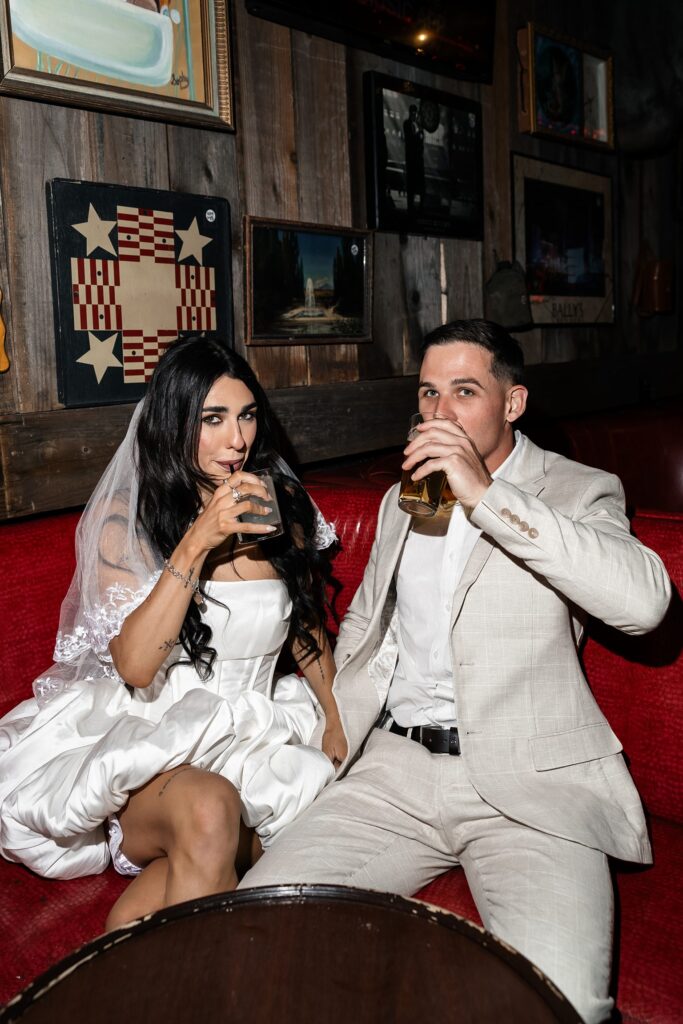 Bride and groom having drinks