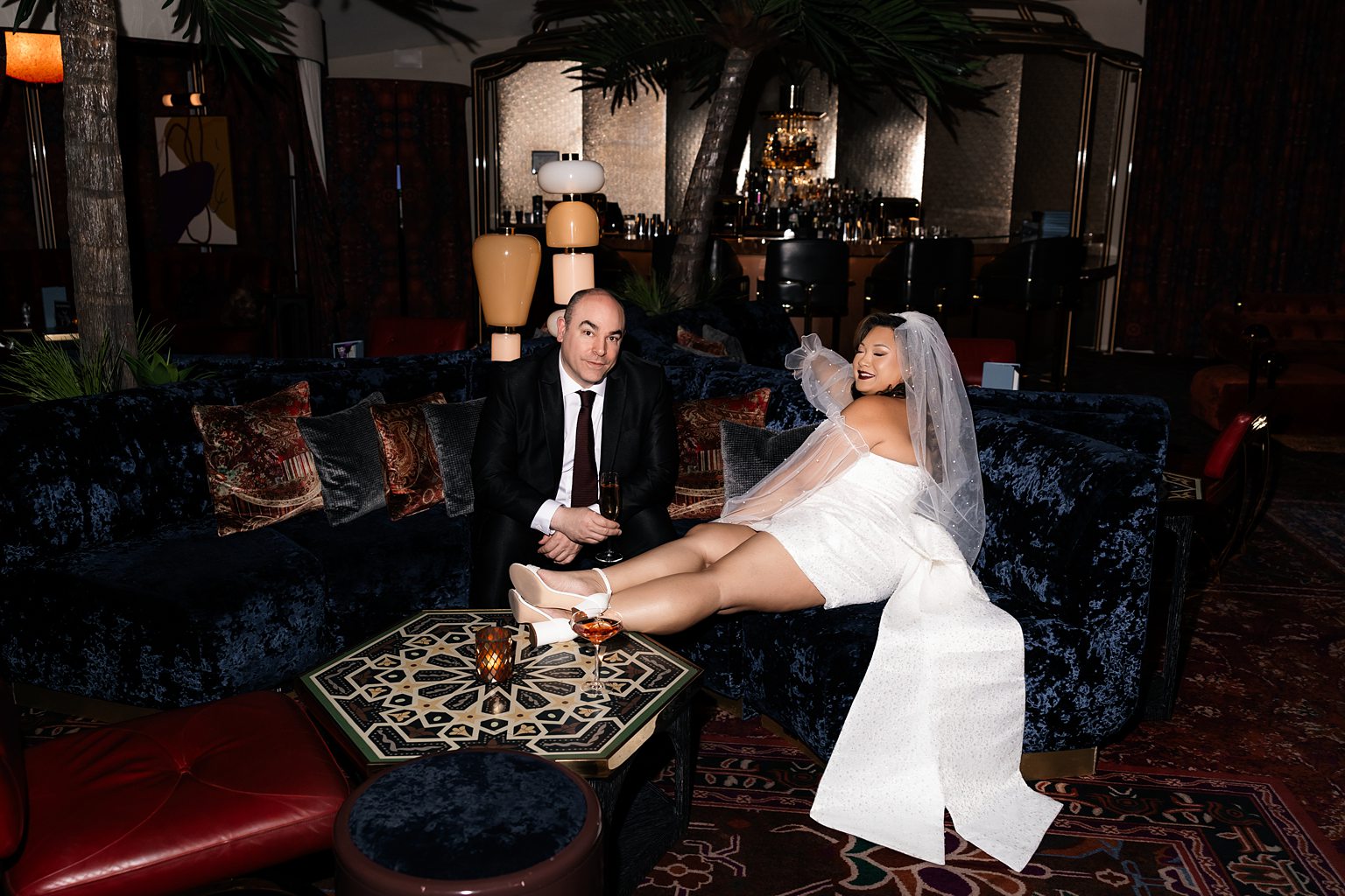 Bride and groom posing in The Shag Room at The Virgin Hotel 5 Mistakes to Avoid When Eloping in Vegas