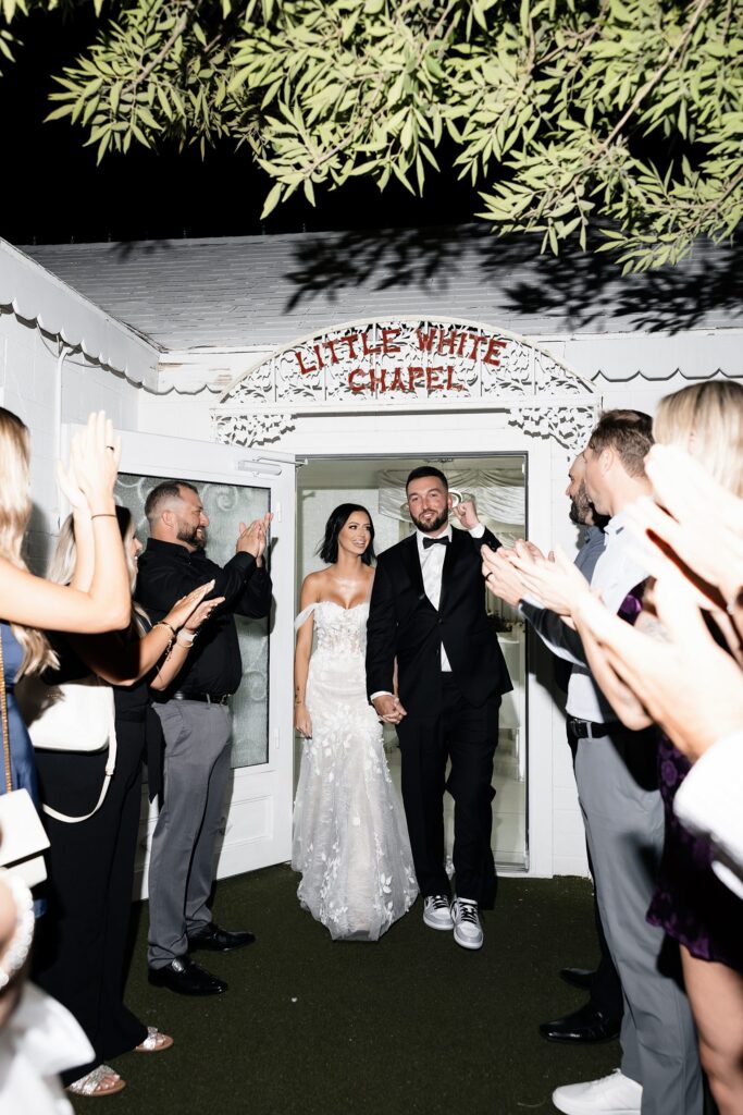 Bride and groom exiting their Little White Chapel elopement ceremony