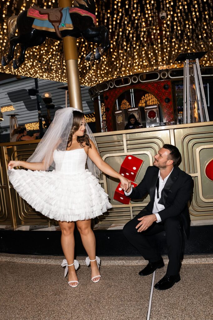 Bride and groom posing at Carousel Bar in Las Vegas