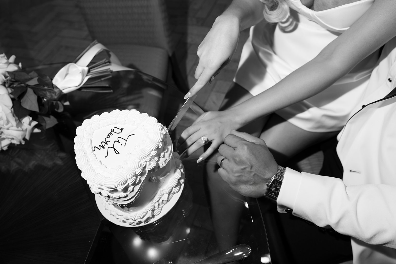 Bride and groom cutting into their elopement cake - 5 Mistakes to Avoid When Eloping in Vegas