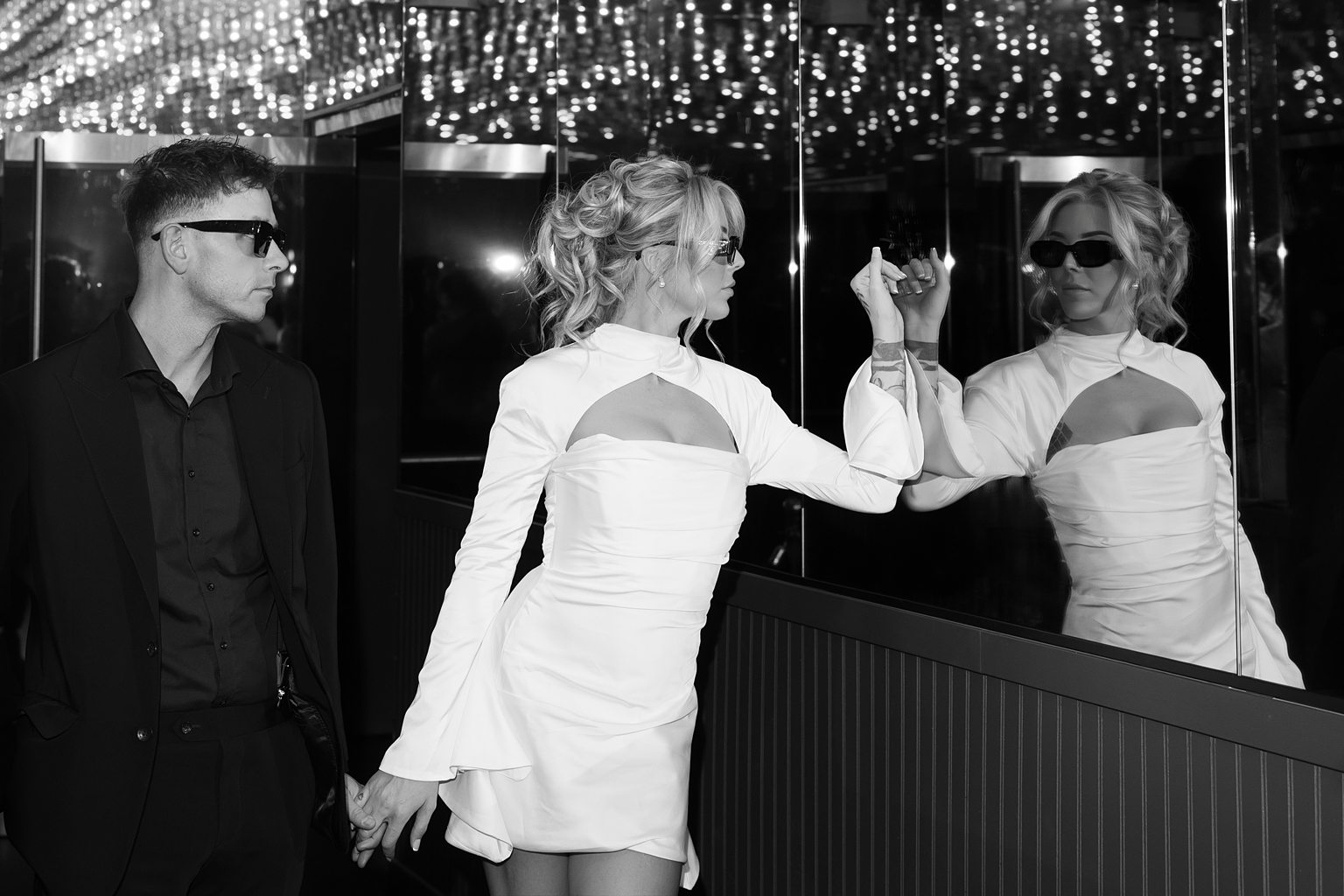 Black and white photo of a couple posing during their Las Vegas elopement on Fremont Street