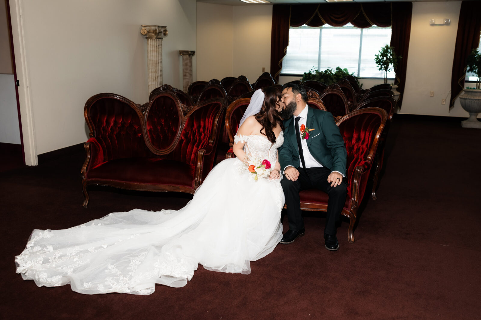 Bride and groom kissing in Chapel Amore in Las Vegas