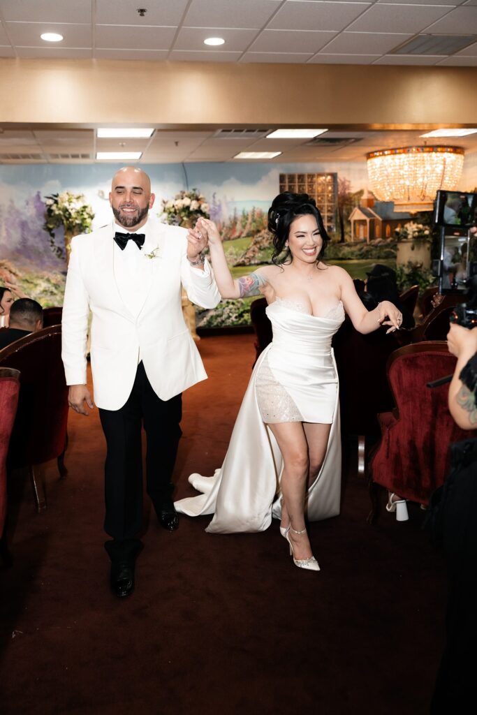 Bride and groom walking back down the aisle after their Chapel Amore elopement ceremony