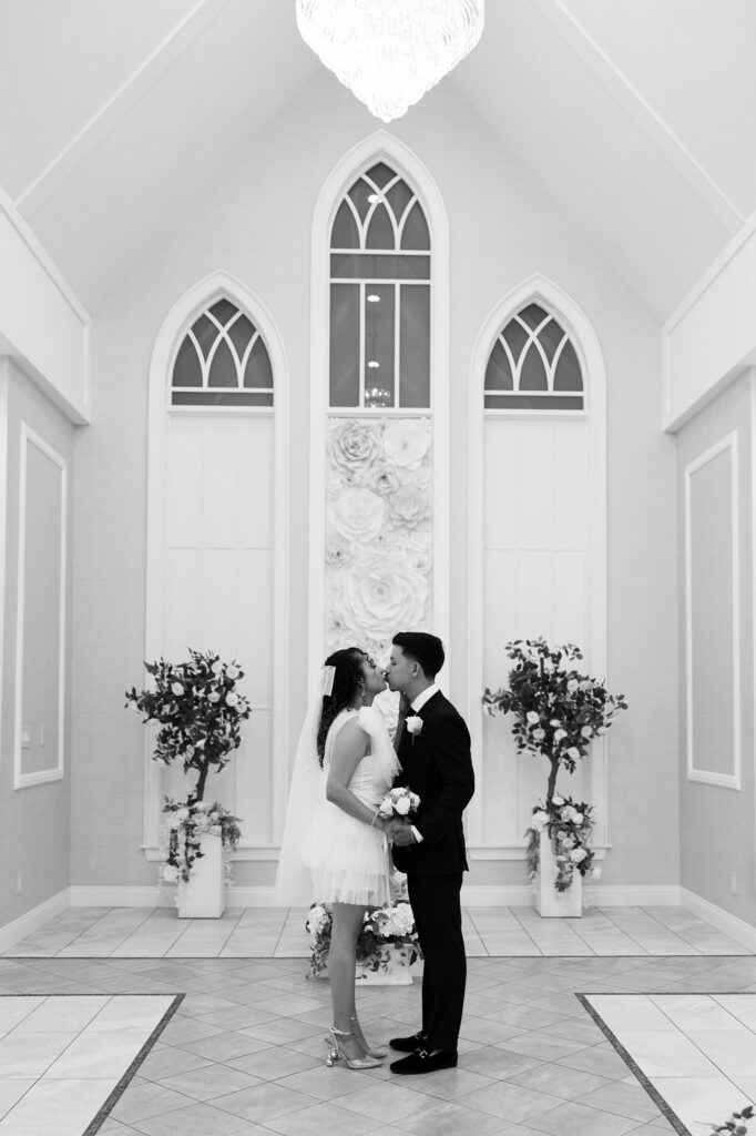 Black and white photo of a couple kissing at Bliss Wedding Chapel Las Vegas